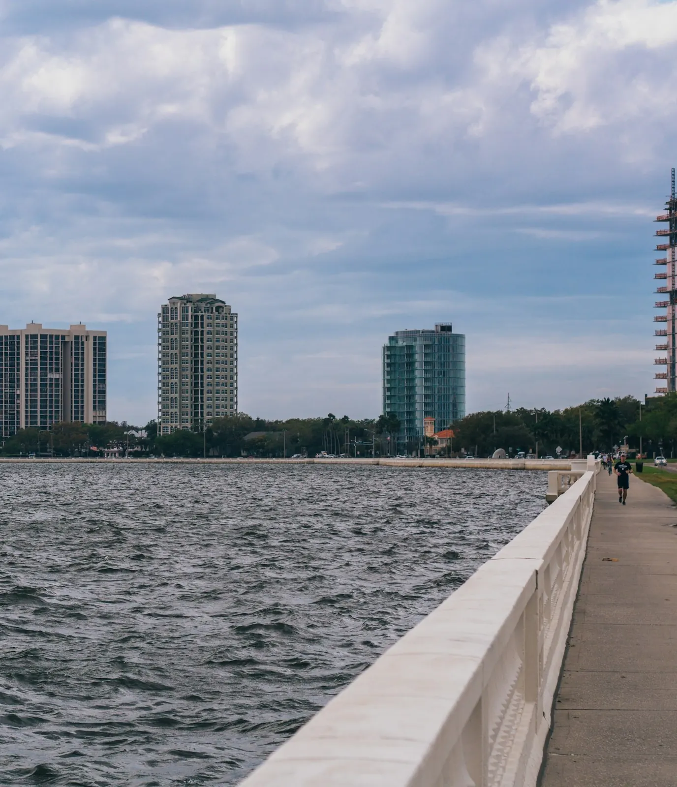 Bayshore Boulevard's white balustrade and waterfront sidewalk along Tampa Bay in South Tampa